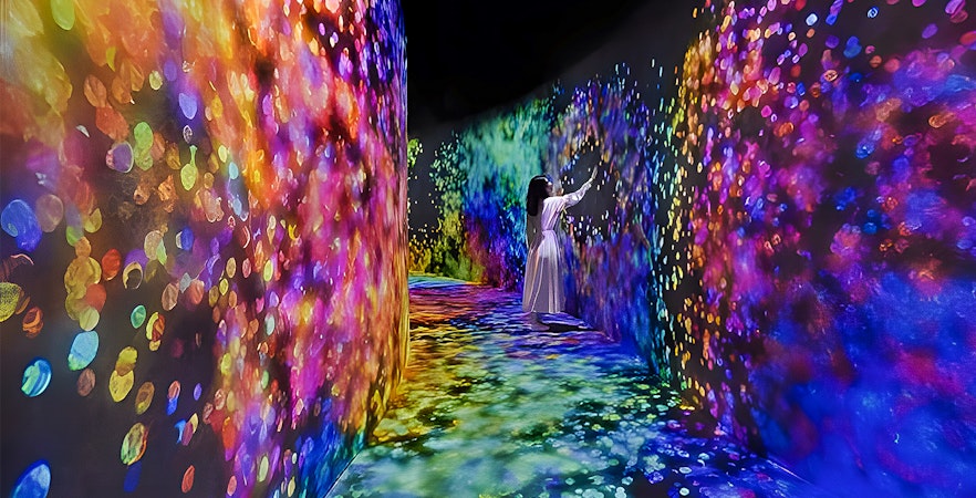 TeamLab Phenomena Abu Dhabi interactive digital art installation with vibrant light displays.