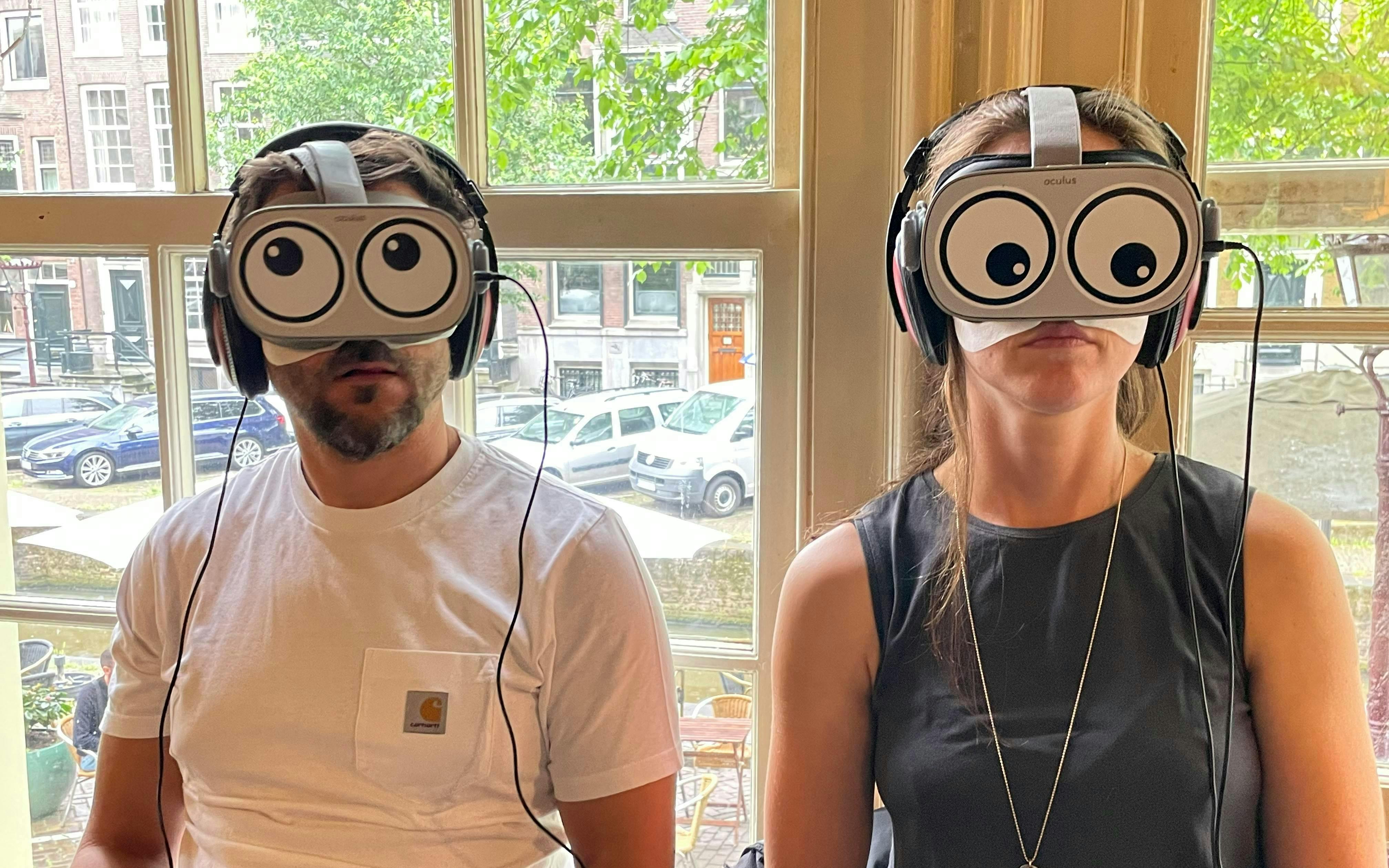 Visitors using VR headsets during Anne Frank House tour in Amsterdam.