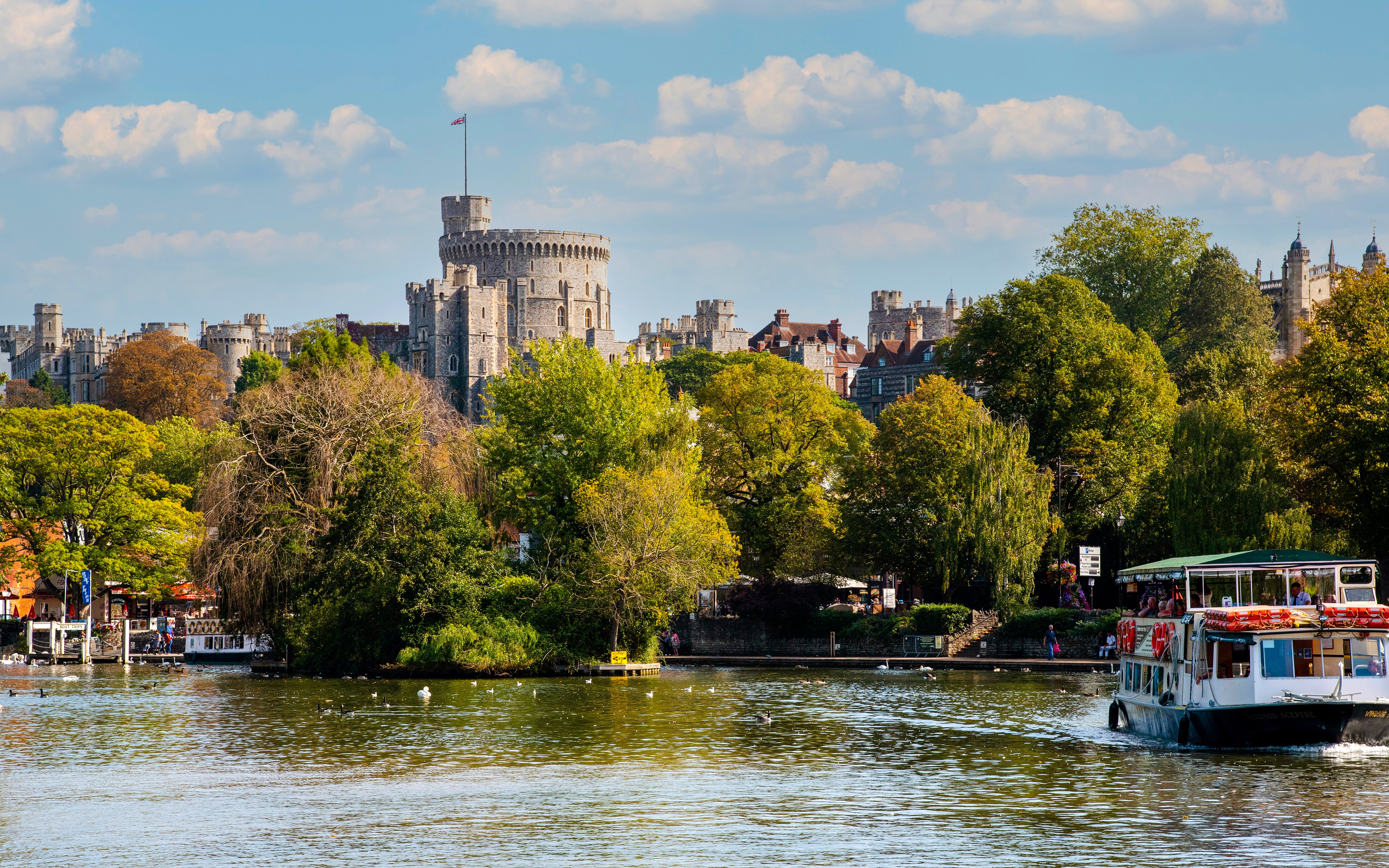 Boat ride on the River Thames with Windsor Castle in the background.
