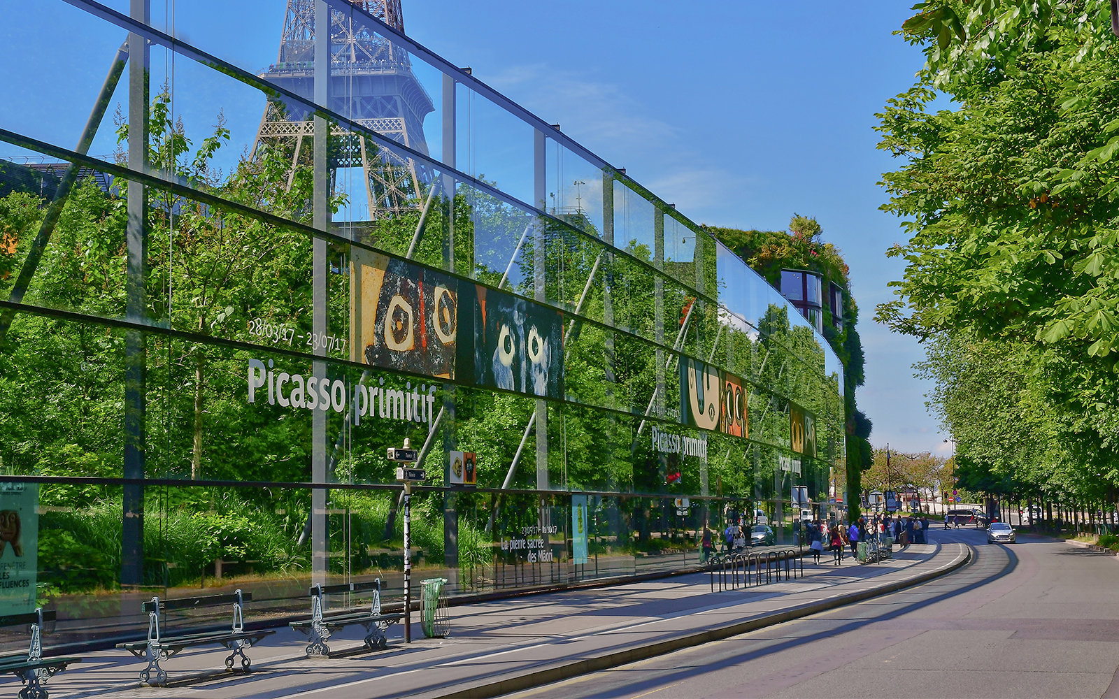 Quai Branly road with Eiffel Tower and museum in Paris.