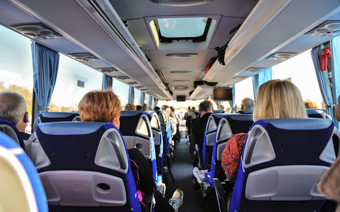 Bus interior with passengers traveling from Tromso to Skjervoy.
