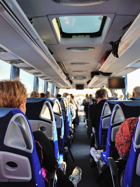 Bus interior with passengers traveling from Tromso to Skjervoy.
