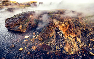Steaming geothermal rocks at Secret Lagoon, Gamla Laugin, Iceland.