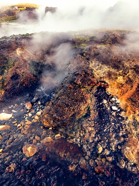 Steaming geothermal rocks at Secret Lagoon, Gamla Laugin, Iceland.