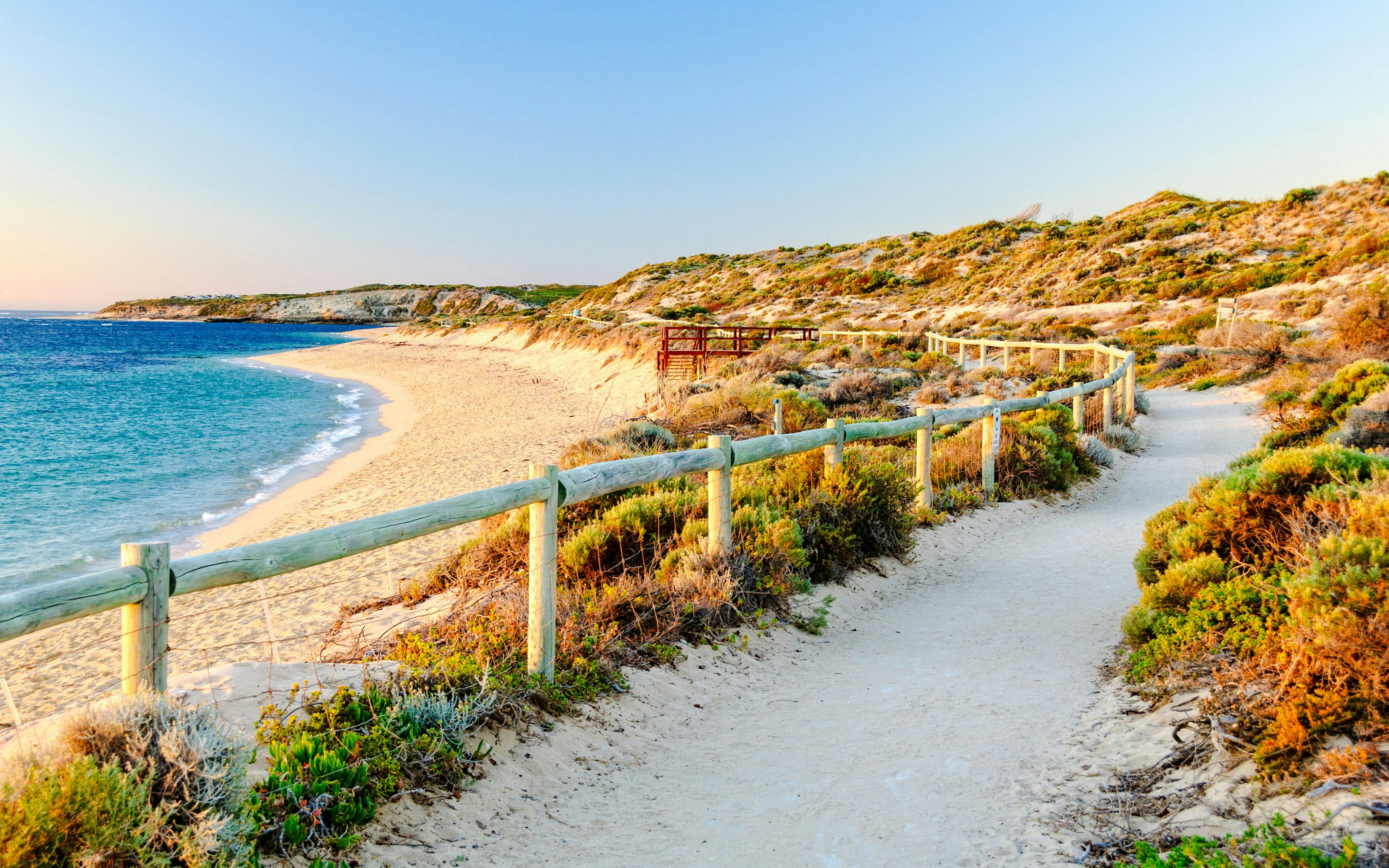 Walking path along Gnarabup Beach with ocean view and coastal vegetation.