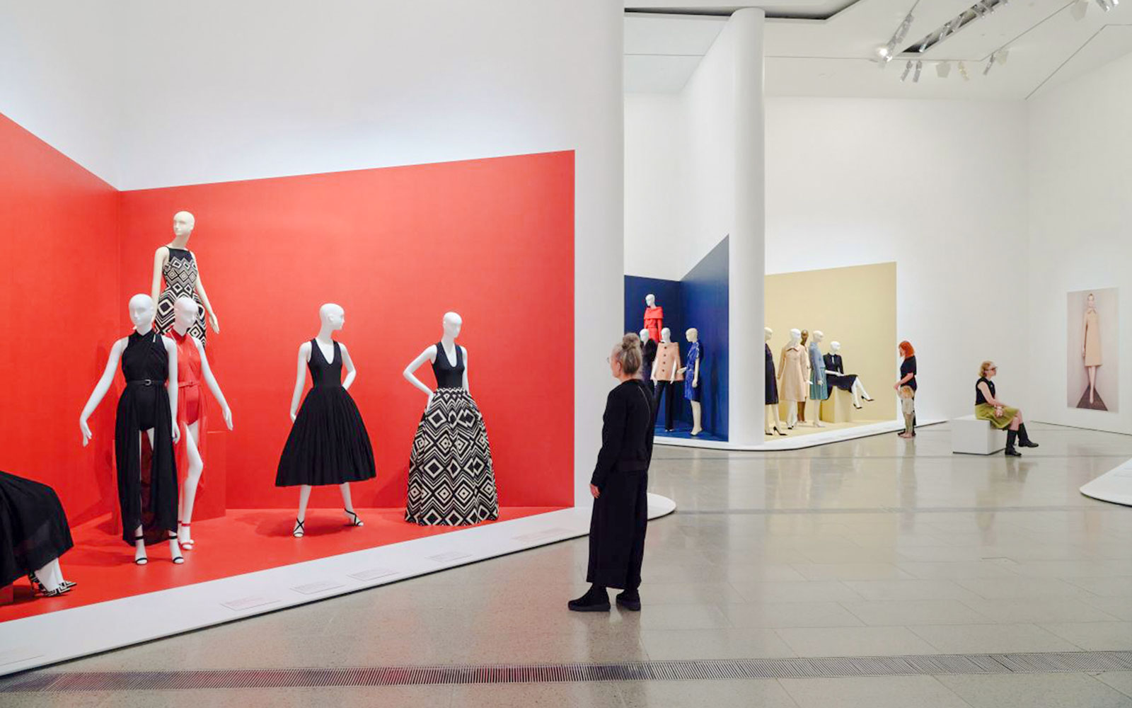 Visitors viewing fashion displays at Martin Grant Exhibition.