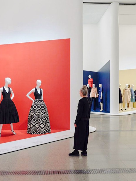 Visitors viewing fashion displays at Martin Grant Exhibition.