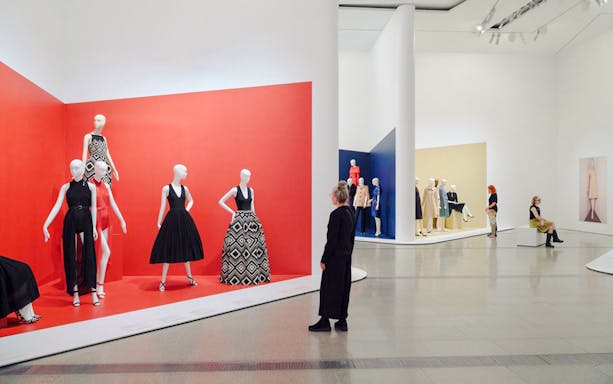 Visitors viewing fashion displays at Martin Grant Exhibition.
