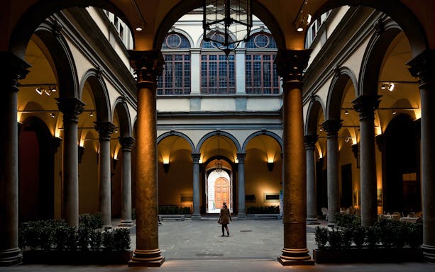 Palazzo Strozzi courtyard with visitor, Florence, Italy, for Yan Pei-Ming exhibition.