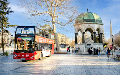 Hop on hop off bus near German Fountain in Sultanahmet Square, Istanbul.