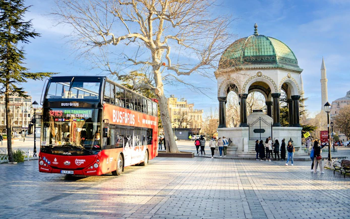 Hop on hop off bus near German Fountain in Sultanahmet Square, Istanbul.