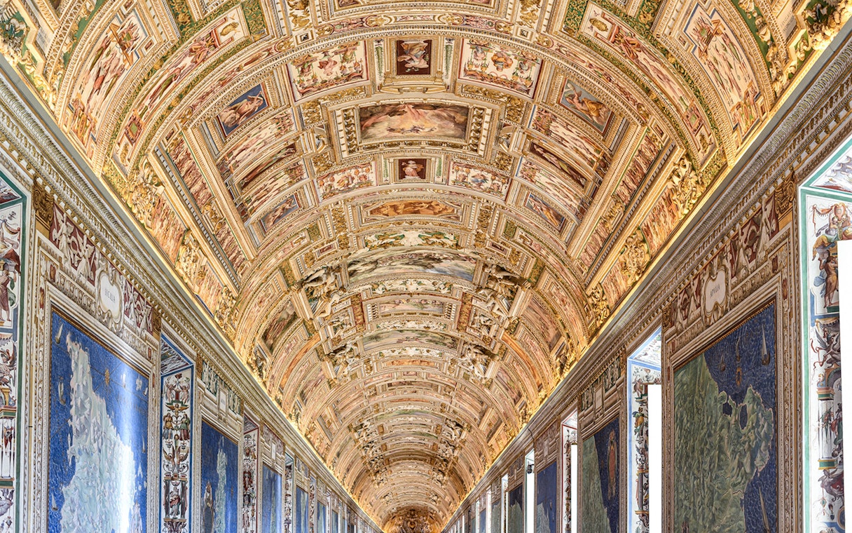 Vatican Museums' ornate ceiling and map gallery, Rome.