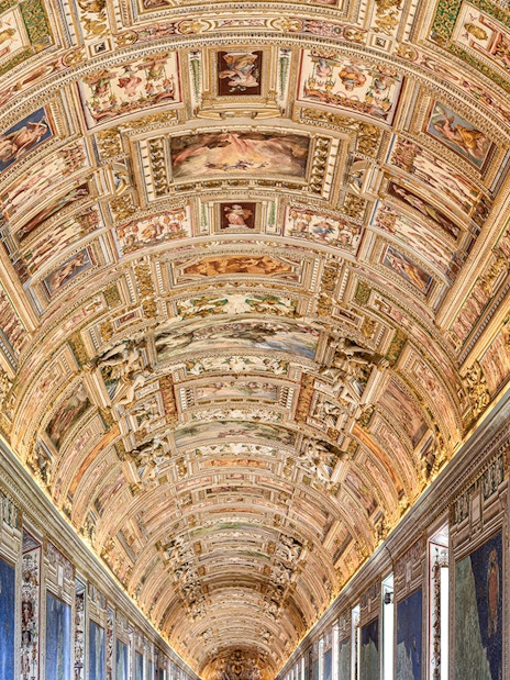 Vatican Museums' ornate ceiling and map gallery, Rome.
