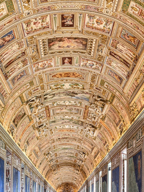 Vatican Museums' ornate ceiling and map gallery, Rome.