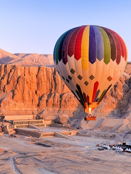 Hot air balloon over Hatshepsut Temple in Luxor, Egypt.