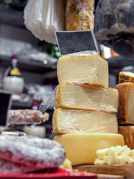 Cheese and cured meats display on a guided food tour in Florence.