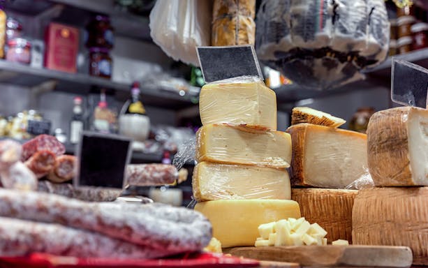 Cheese and cured meats display on a guided food tour in Florence.