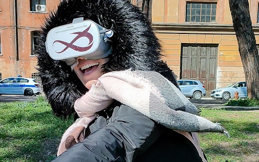 Person enjoying virtual reality game near Circus Maximus, Rome.