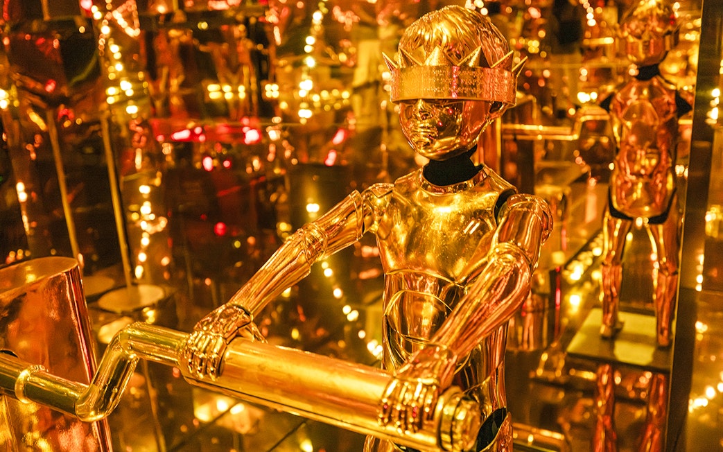 Golden humanoid robot exhibit at Mercer Labs: Museum Of Art & Technology.
