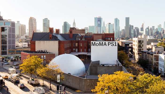 MoMA building exterior in New York City with modern architectural design.