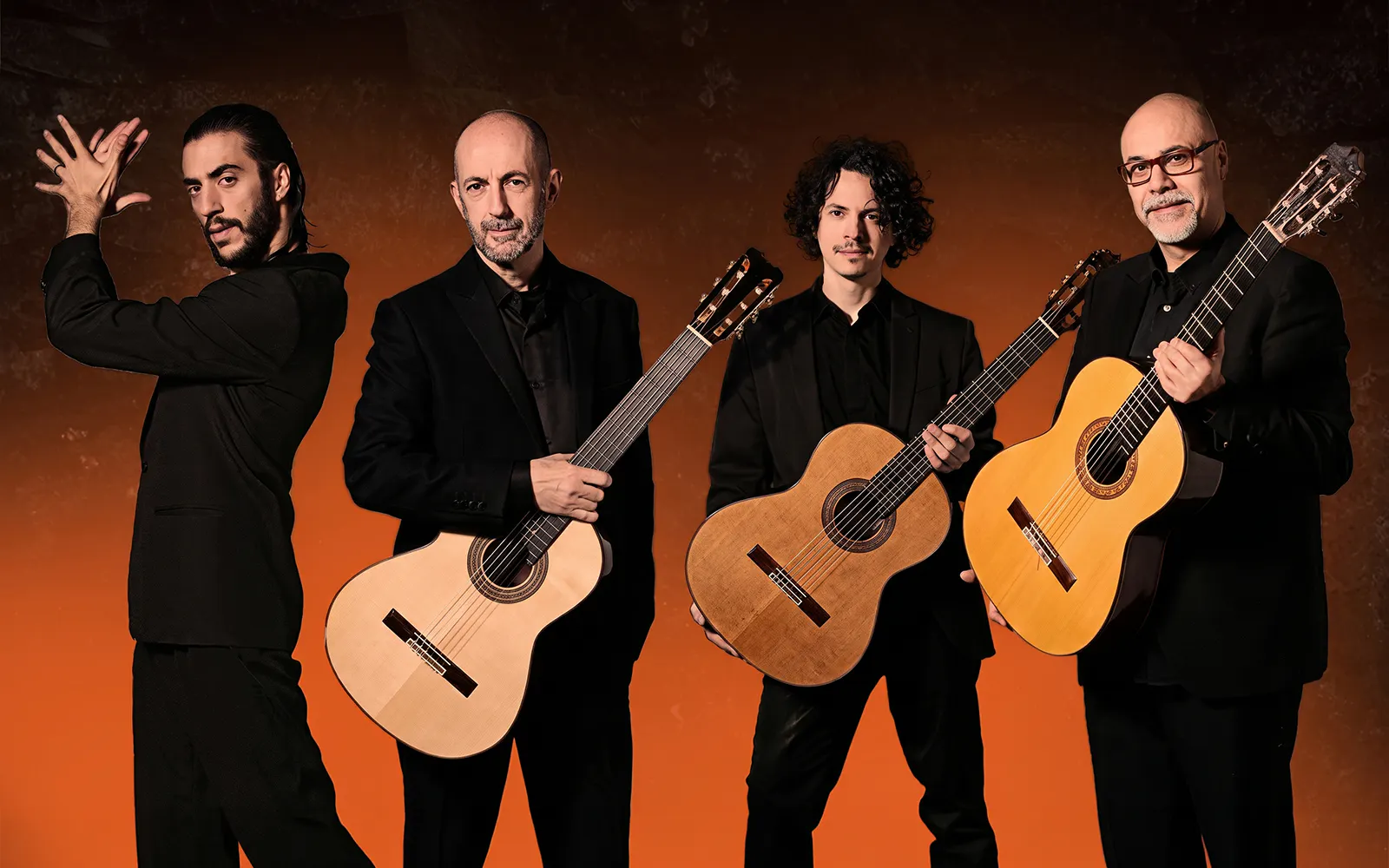 Flamenco performers with guitars at Barcelona La Perla del Born show.