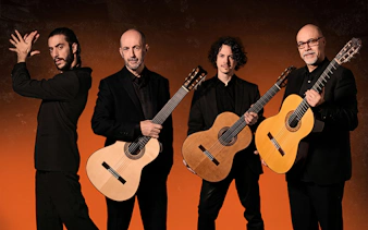 Flamenco performers with guitars at Barcelona La Perla del Born show.