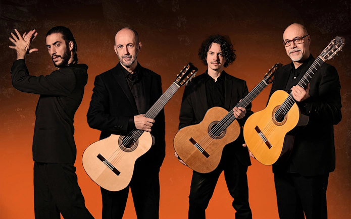 Flamenco performers with guitars at Barcelona La Perla del Born show.
