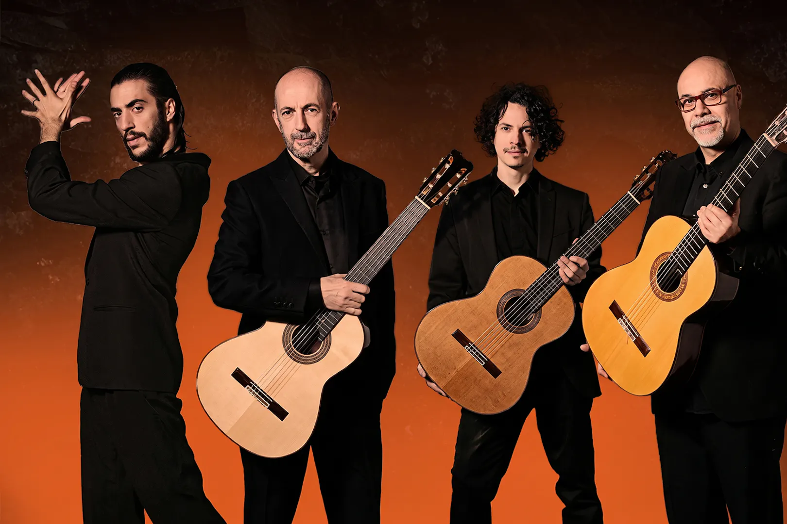 Flamenco performers with guitars at Barcelona La Perla del Born show.