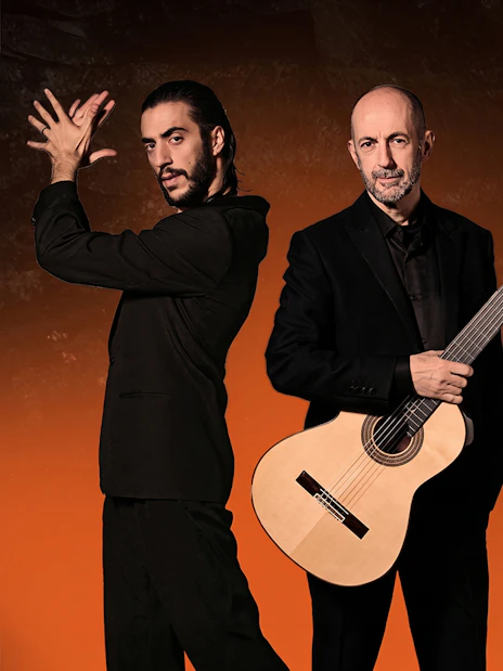 Flamenco performers with guitars at Barcelona La Perla del Born show.
