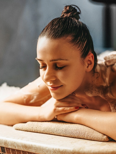 Person enjoying a foam massage at a historical hammam in Istanbul, Turkey.