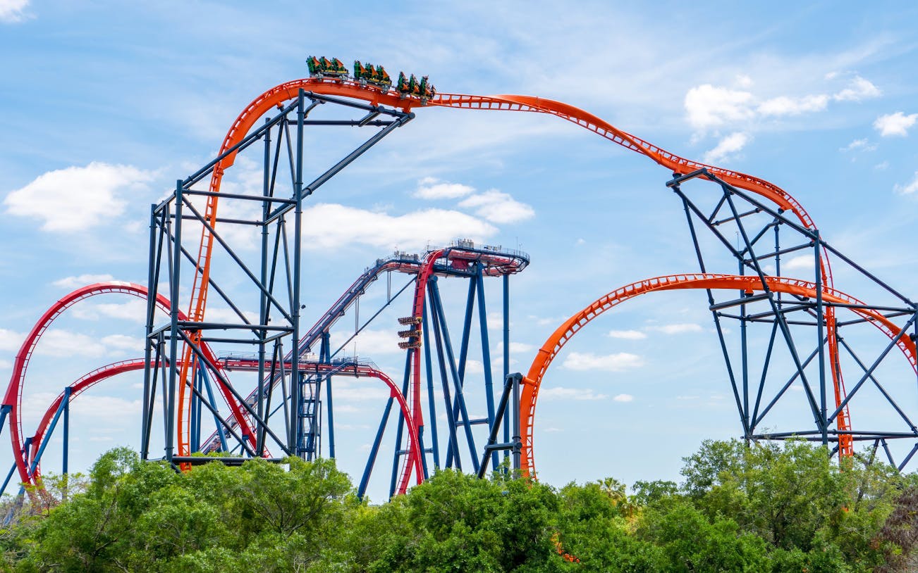 Roller coaster at Busch Gardens Tampa with loops and riders.
