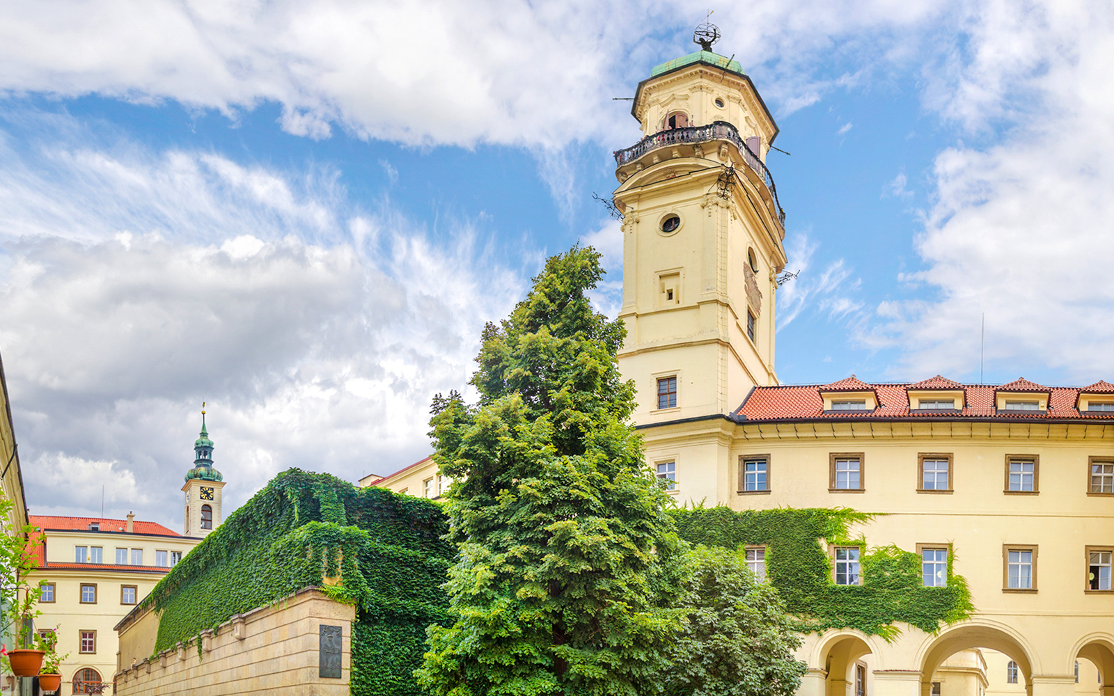 Klementinum tower and ivy-covered walls in Prague.