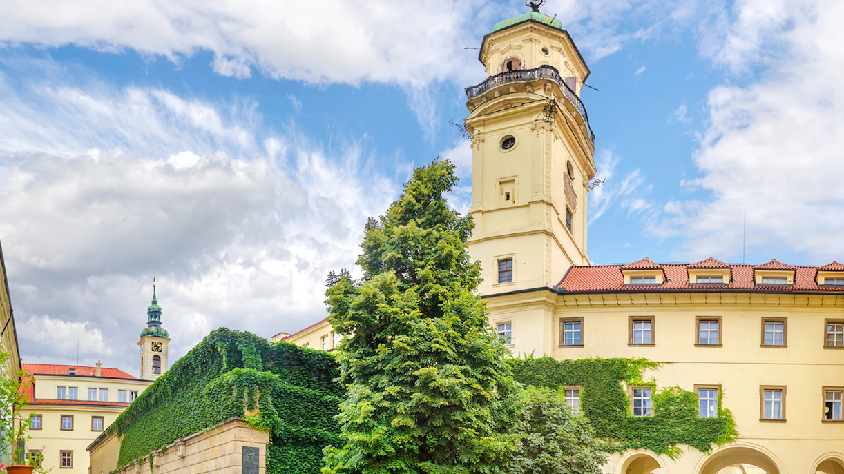 Klementinum tower and ivy-covered walls in Prague.