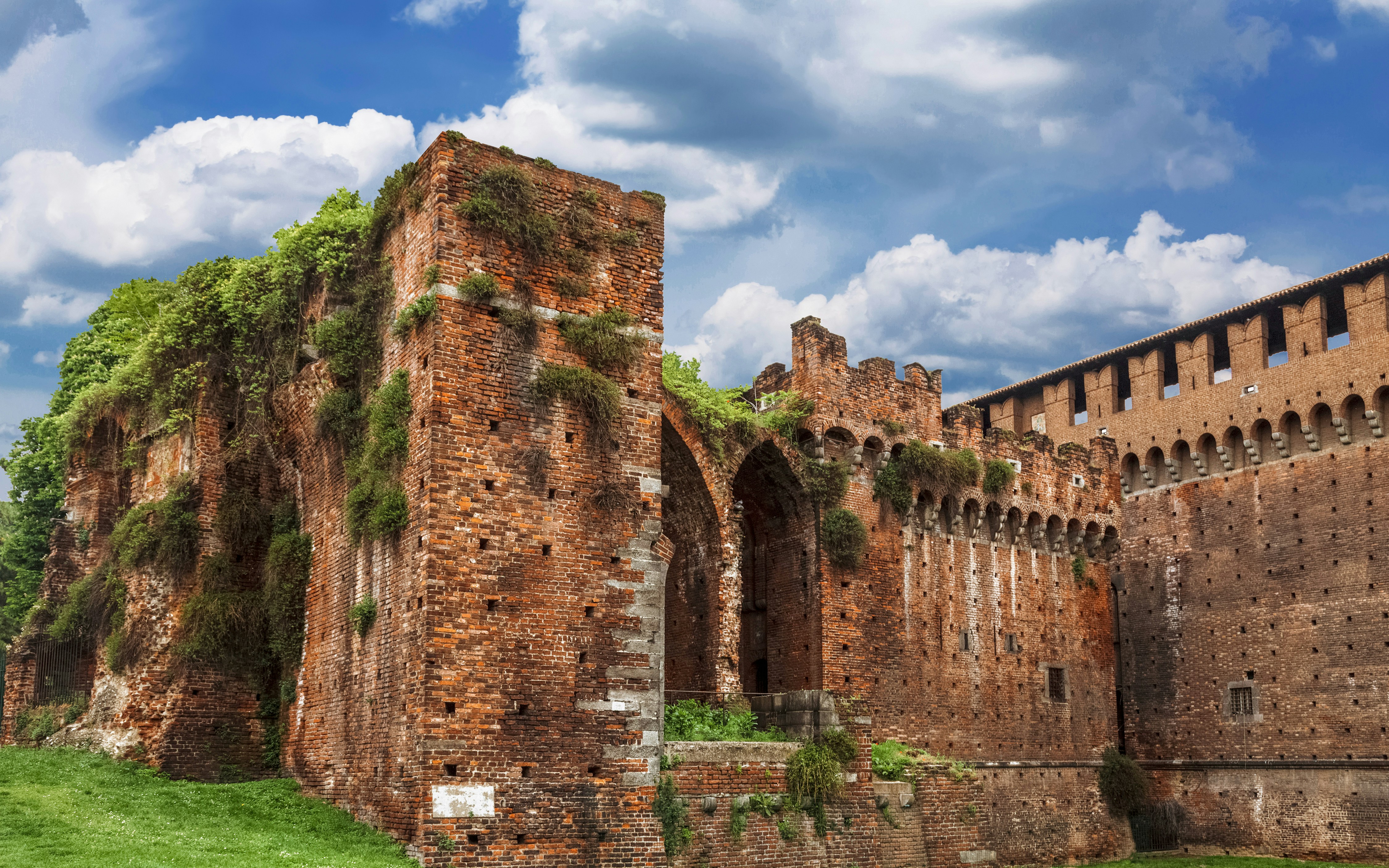 Sforza Castle's ancient brick walls and towers in Milan, Italy.