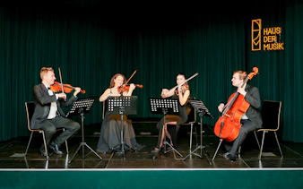 String quartet performing at Haus der Musik during Mozart & Beethoven concert.