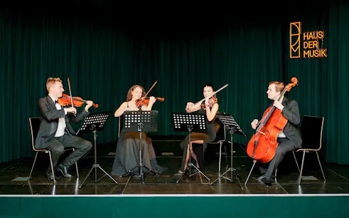 String quartet performing at Haus der Musik during Mozart & Beethoven concert.
