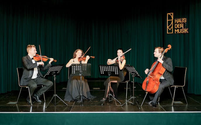 String quartet performing at Haus der Musik during Mozart & Beethoven concert.