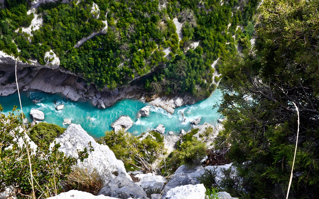 Verdon Gorges turquoise river view surrounded by lush greenery, France.
