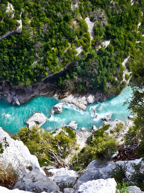 Verdon Gorges turquoise river view surrounded by lush greenery, France.