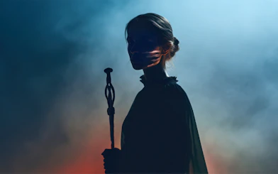 Silhouette of a person holding a staff at the National Museum of Denmark exhibit.