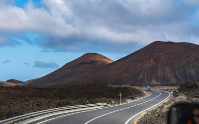 Winding road through volcanic landscape in Timanfaya National Park, Lanzarote.