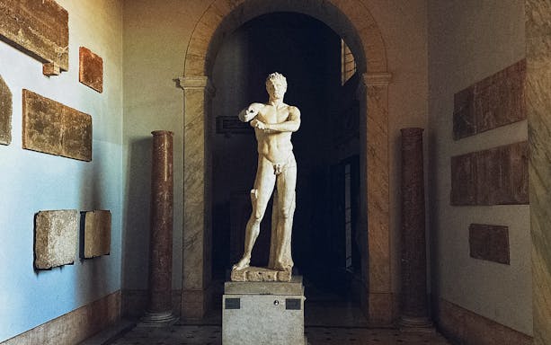 Statue of Apoxyomenos in Pio Clementine Museum, Vatican City.
