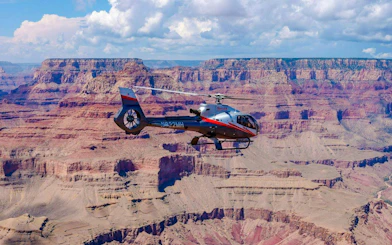 Helicopter flying over Grand Canyon South Rim.