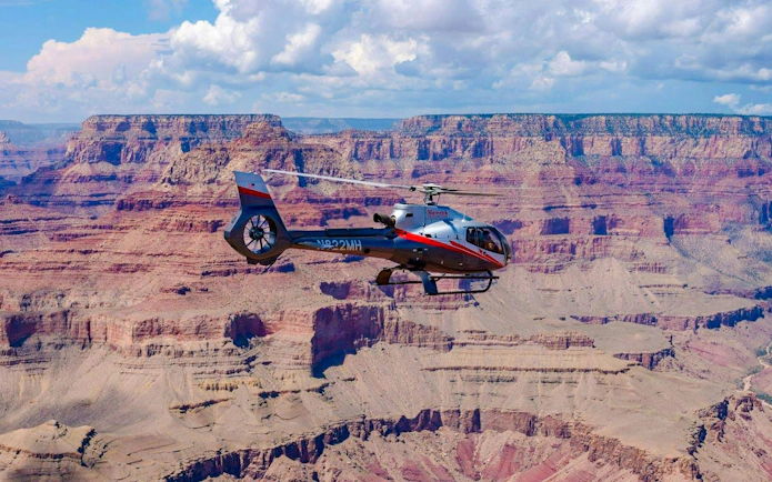 Helicopter flying over Grand Canyon South Rim.