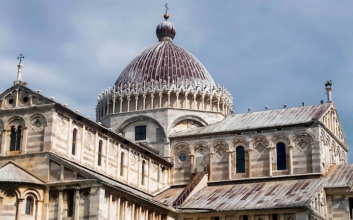 Pisa Cathedral dome and facade on a guided walking tour with skip-the-line access.