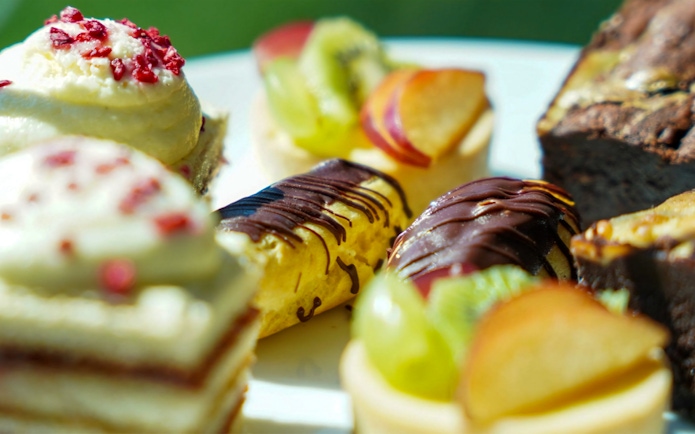 Assorted pastries and cakes on the Afternoon Tea Bus.
