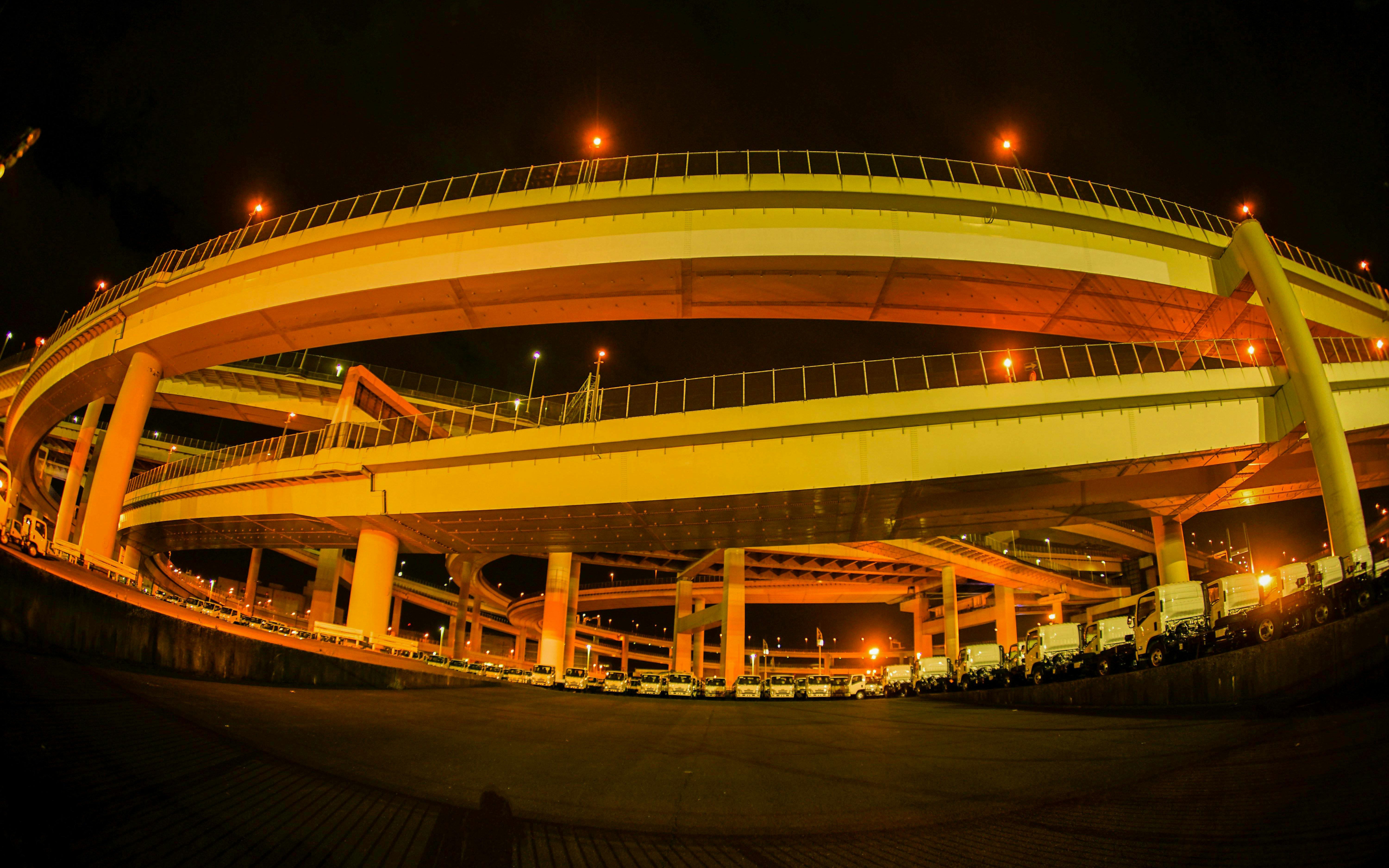 Elevated highway at night during Daikoku PA car meeting in Yokohama, Japan.