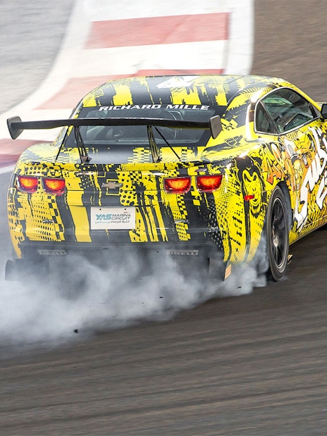 Chevrolet drifting at Yas Marina Circuit during passenger experience.