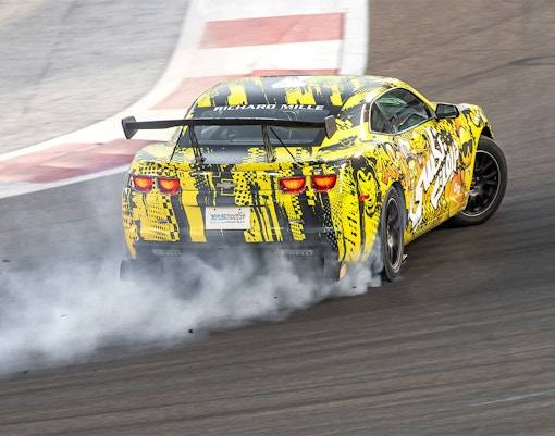 Chevrolet drifting at Yas Marina Circuit during passenger experience.
