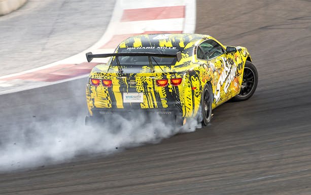 Chevrolet drifting at Yas Marina Circuit during passenger experience.